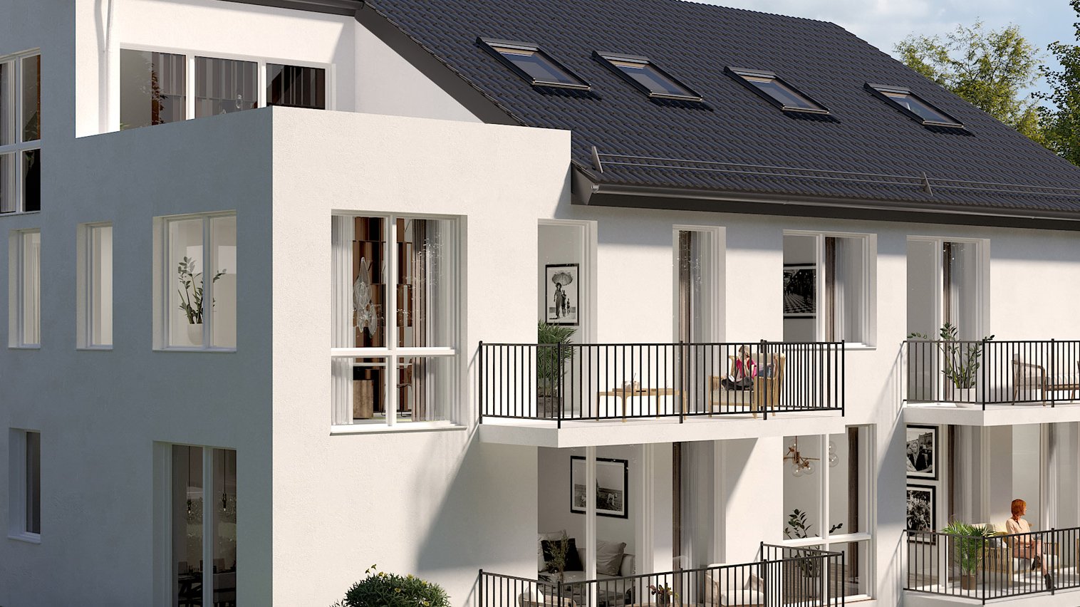 Mehrfamilienhaus mit hellen Fassaden, großen Fenstern und Balkonen